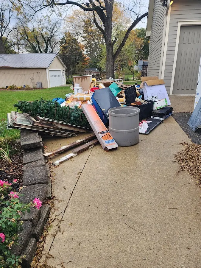 Dumpster being loaded with debris for Demolition Dumpster Rental in Hogansville